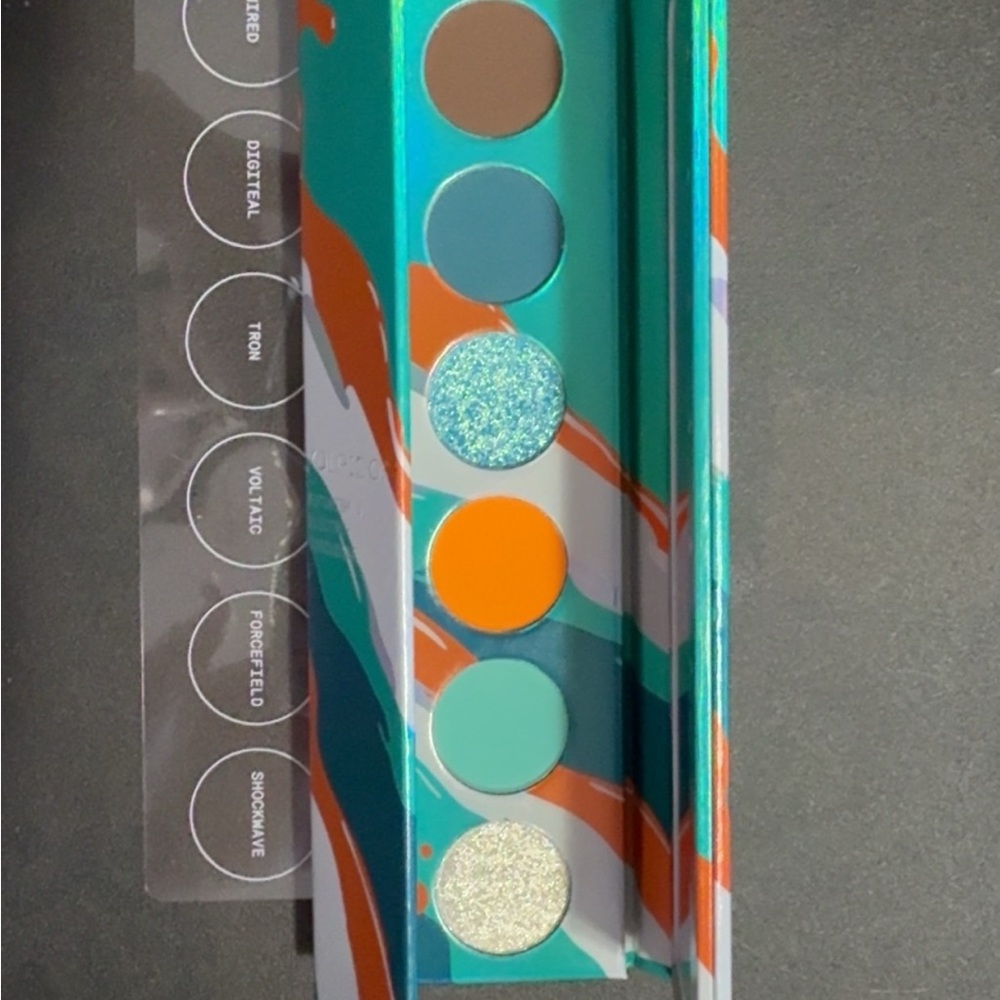 Vibrant Eyeshadow Palette with Teal and Orange Shades